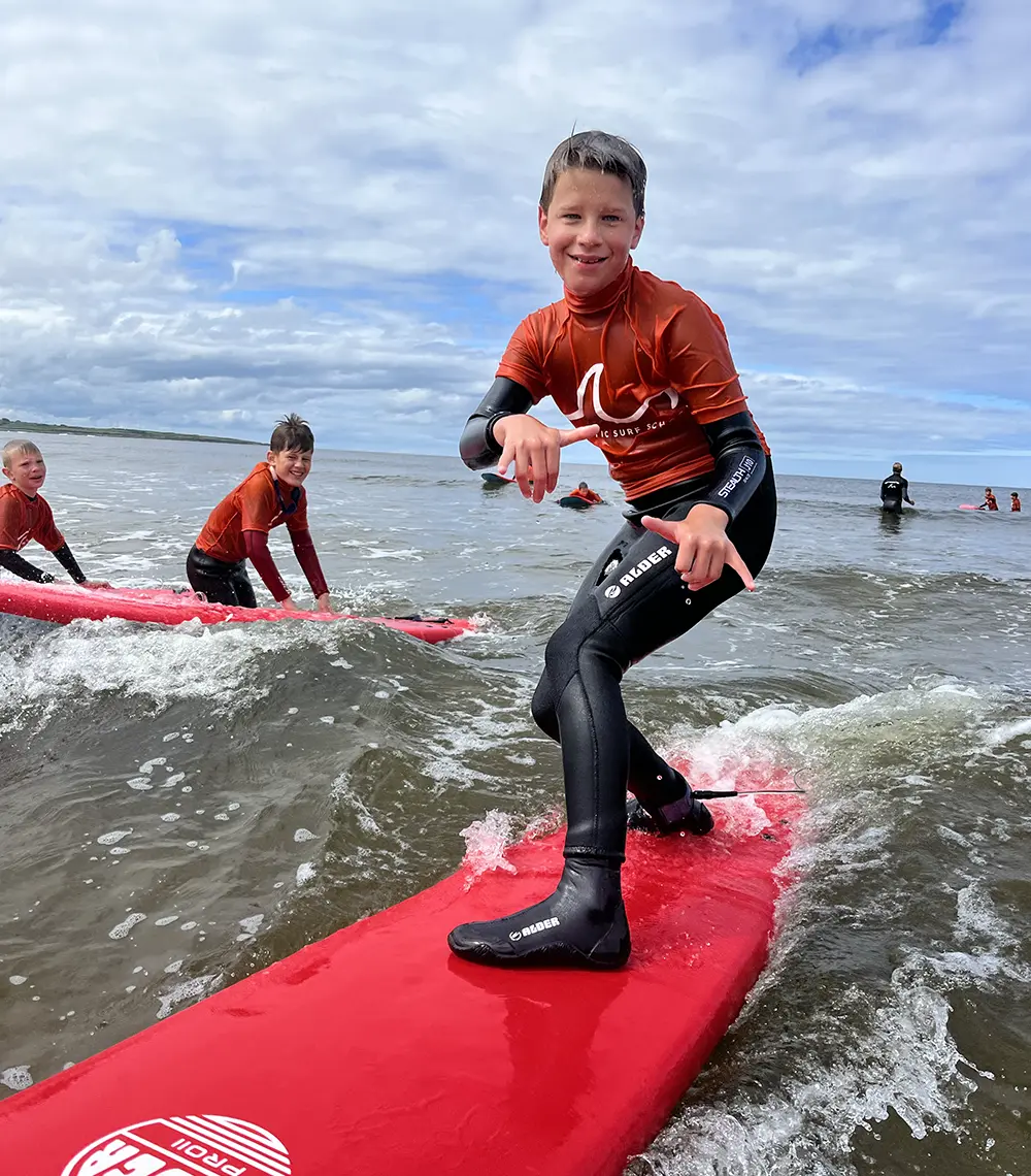 A boy surfing in ocean