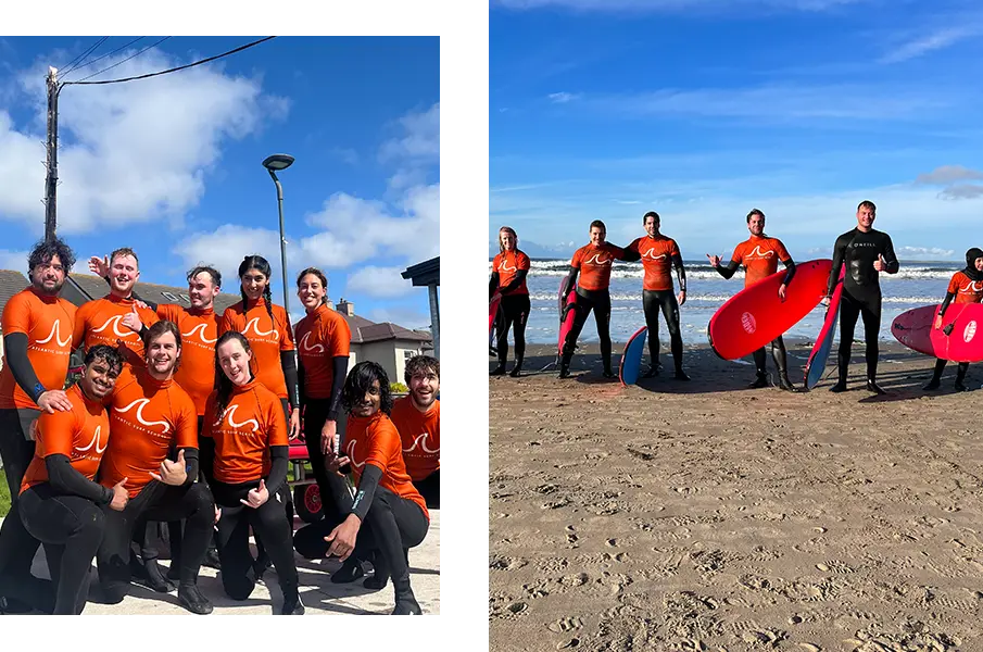 Group of corporate people posing with surf boards