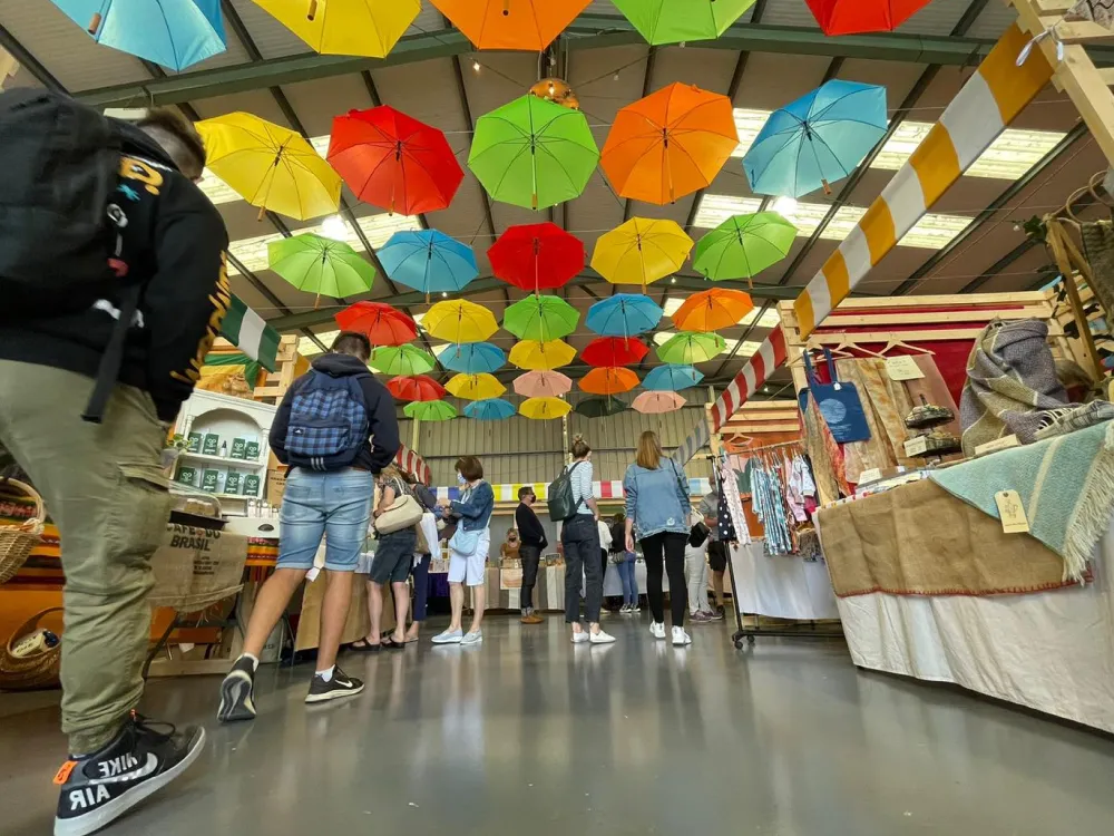 People walking and shopping in Sunday market