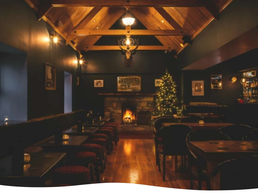 Interior view of Bree's Bar & Restaurant, showcasing the bar area with drinks and seating.